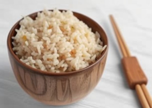 A bowl of white rice grains.