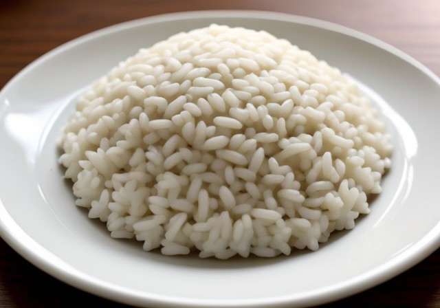 A bowl of white rice grains.